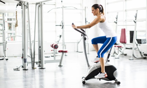 Aerobics spinning woman exercise workout at  bikes gym