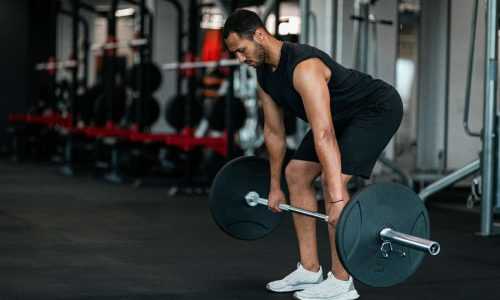 wsi imageoptim 0 sporty black man lifting heavy barbell while training gym