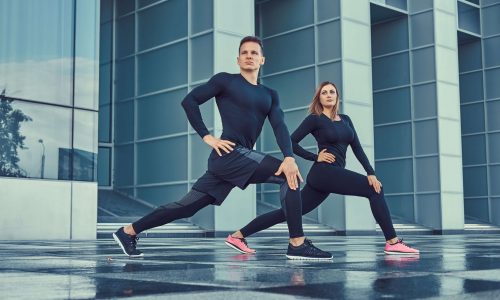 wsi imageoptim 0 young fitness couple sportswear doing lunges modern city against skyscraper healthy lifestyle concept min scaled